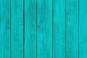 Painted in turquoise wooden wall panels as texture, background photo