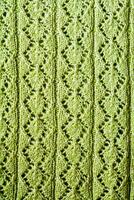 Woolen yarn with lurex with an openwork pattern background photo