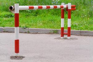 Metal red white barrier on the road photo