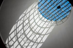 Lattice round window overlooking the sky abstract photo