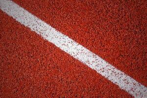 White line on a surface of running track texture, background, vignette photo