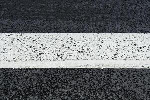 White line on the asphalt road photo