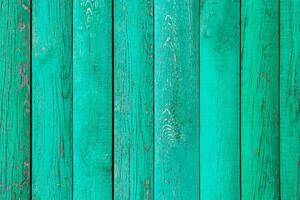 Painted in turquoise wooden wall panels as texture, background photo