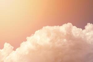 Cumulus fluffy clouds illuminated by sunlight photo