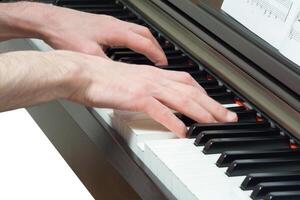 Hands playing the piano photo