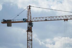 tower crane against clouds photo