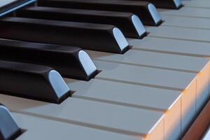 Piano keys side view with warm light photo