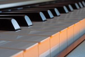 Piano keys side view with warm light photo