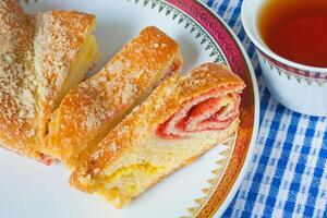 cherry strudel with tea photo