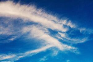 Clouds in the sunlight against the blue sky photo