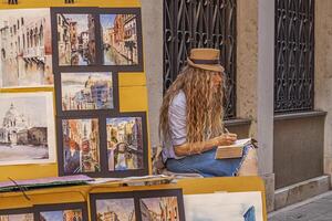 VENICE ITALY 2 JULY 2020 Street artist painter in Venice photo