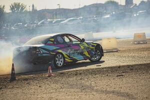 villamarzana 10 septiembre 2023 intenso coche carrera capturar el emoción de a la deriva en un desafiante circuito foto