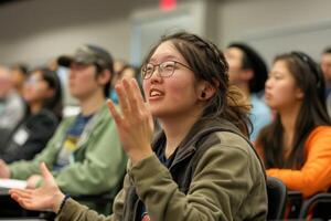 A picture of a hearing-impaired student using a sign language interpreter during a lecture, emphasizing the provision of communication support to facilitate effective learning. photo