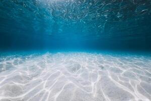 Transparent ocean with sandy bottom and sun light underwater in Florida. Sea background photo