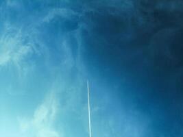 Summer blue sky cloud gradient light white background. Gloomy bright blue landscape in environmental daytime horizon. Airplane. Airplane flight photo