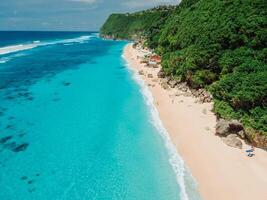 Paradise beach with turquoise transparent ocean in Bali. Aerial view photo