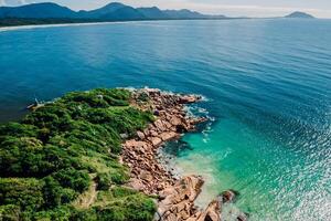 Landscape with rocks and blue ocean in Brazil. Aerial view photo