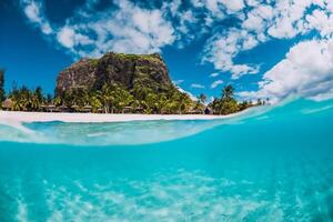 Tropical transparent ocean with Le Morne mountain and luxury beach in Mauritius. Split view. photo
