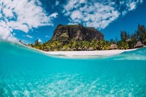 Tropical transparent ocean with Le Morne mountain and luxury beach in Mauritius. Split view. photo