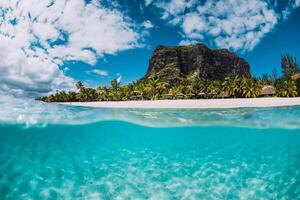 Tropical transparent ocean with Le Morne mountain and luxury beach in Mauritius. Split view. photo