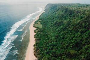 Wild Nyang Nyang beach and ocean in Bali island. Drone view photo