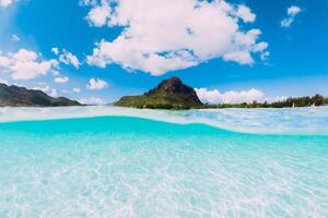 Tropical ocean with sand and Le Morne mountain in Mauritius. photo