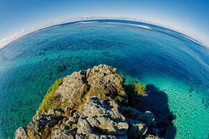 Sunny day at Maconde point with sea in Mauritius Island. Shooting with fish eye photo