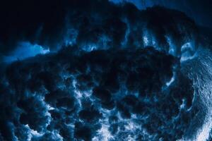 Wave texture underwater in transparent sea. Swell in ocean, crashing waves photo