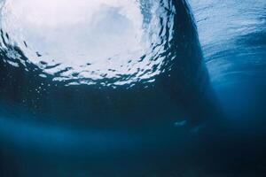 Wave underwater. Blue ocean in underwater. Perfect surfing wave photo
