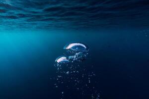 Underwater blue sea with air bubble photo