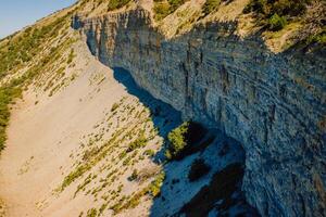 Aerial view of coastline with canyon and cliffs with daylight in Anapa photo