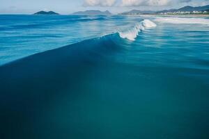 Blue wave in Atlantic ocean. Breaking surfing waves. Perfect swell. Aerial view photo