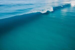 Blue perfect wave in tropical ocean. Breaking barrel wave. Aerial drone view photo