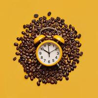 Alarm clock in coffee beans on an empty yellow background. Break or awakening concept photo