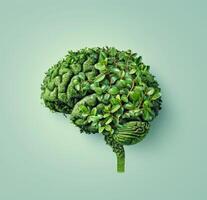 The human brain is made of green plants and foliage on a pastel light green background. Sustainability concept photo