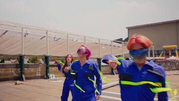 Group of people in colorful outfits dancing outdoors. video