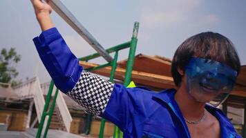 Two workers in blue uniforms and safety glasses at an industrial site. video