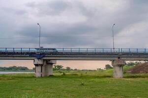 infrastructure of a small concrete girder bridge that crosses the Bengawan Solo River photo
