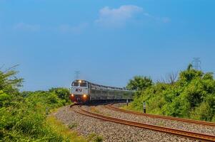 a series of executive class trains called Argo Bromo Anggrek Indonesia which speed on double tracks, Indonesia, 4 May 2024. photo