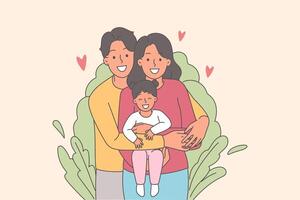 Happy family of mom and dad with little girl in arms, standing near bush and looking at camera vector