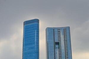 modern highrise building with copy space on a cloudy day photo