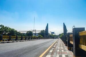 a monument and border gate between the city of Surabaya and Gresik Regency with the signature or name of Gresik Regency, Indonesia, 16 May 2024. photo