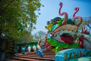 A big statue dragon at Suoi Tien park in Ho Chi Minh Vietnam wide shot photo