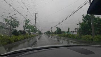 Driving on a Japanese village road, rainy cloudy day view from a car. Hokkaido video