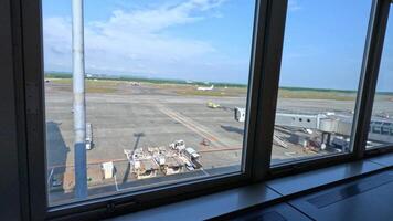 Viewpoint at Sapporo New Chitose airport CTS. Runway view with aircrafts on it video