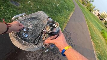 Unsuccessful attempt to get water into a flask from a drinking fountain video