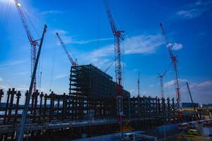 Cranes at the under construction in Tokyo photo