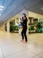 Beautiful black-haired girl on the street, fashion shoot. photo