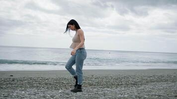 Woman Walking With Boots On The Shoreline video