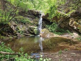 A small waterfall and a beautiful pond with clear water in Kamnik Canyon, Macedonia photo